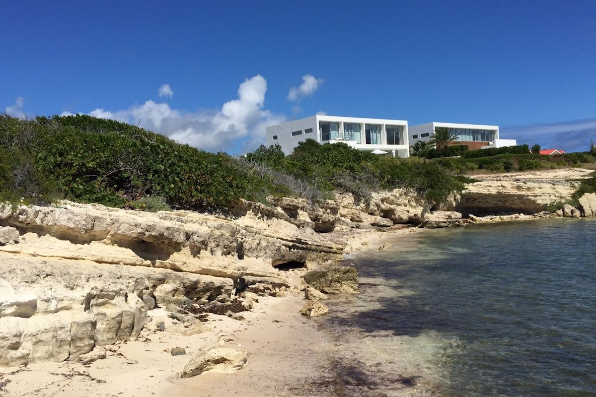 The shoreline below the villas