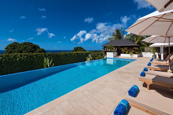 Tom Tom Villa is located in the heart of Royal Westmoreland and features an infinity edge pool 