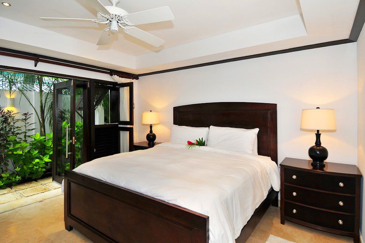 King bedroom with patio access