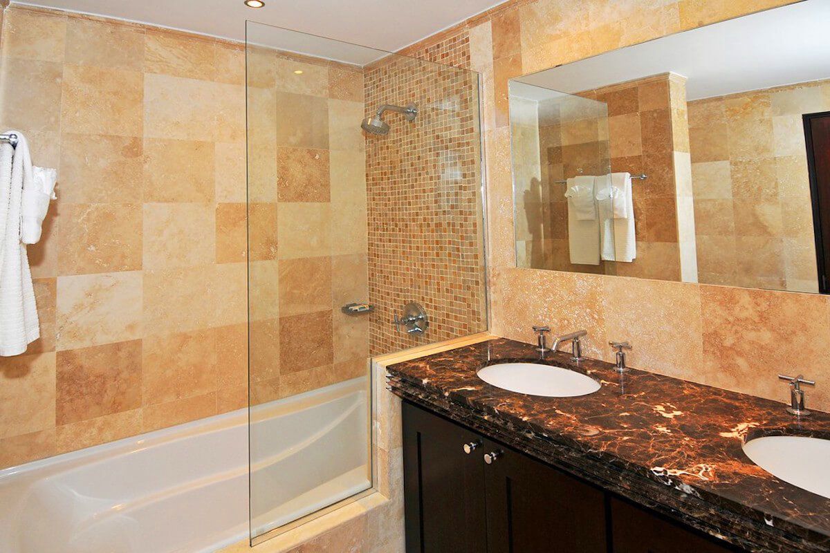 En suite bathroom with a bath tub