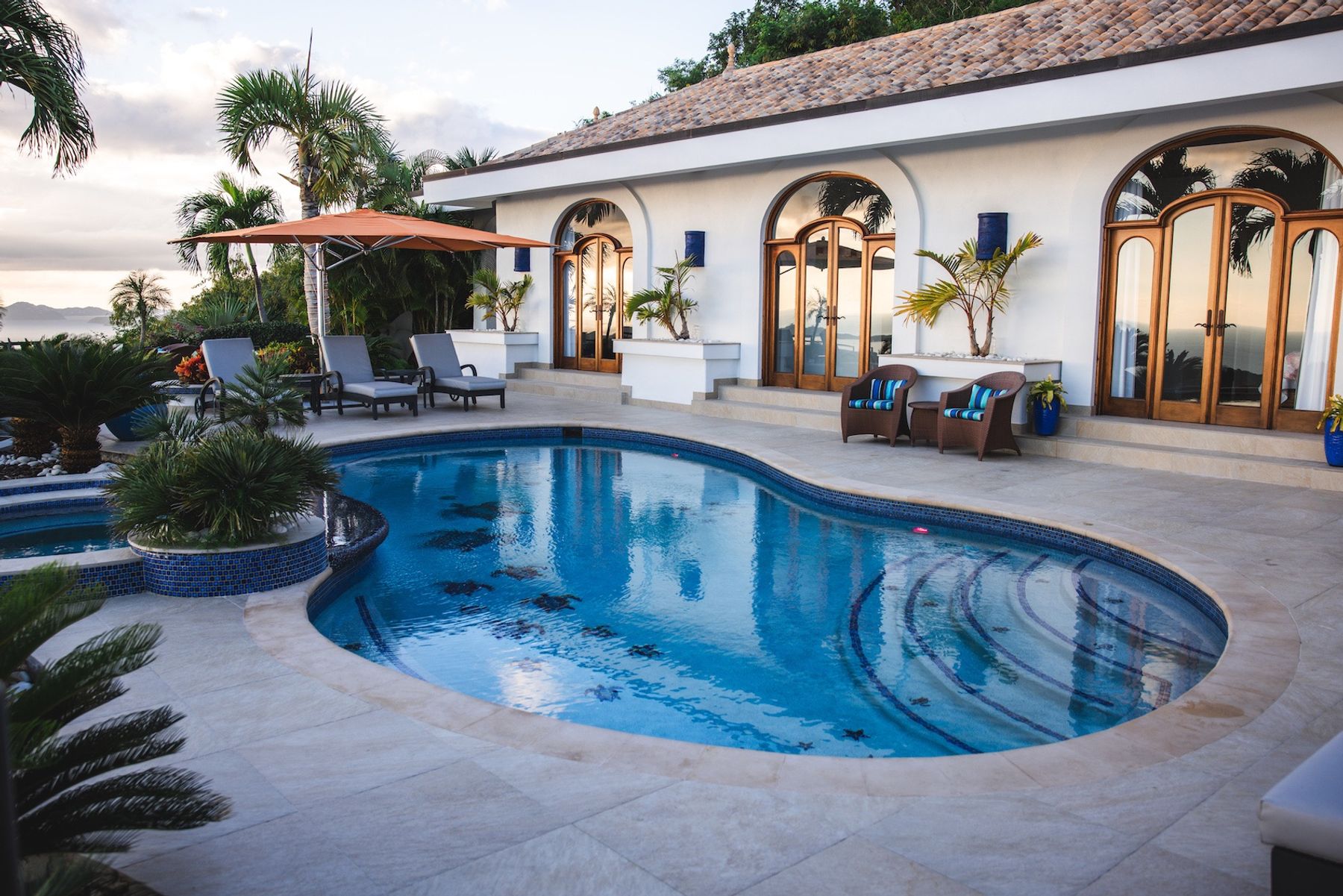View of swimming pool and villa terrace