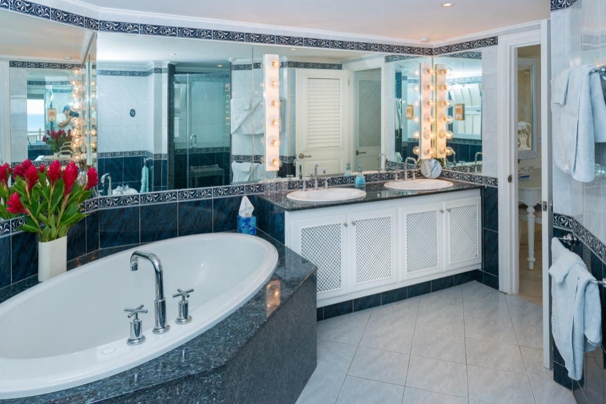 Bathroom with double sinks and tub