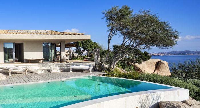 Beautiful private infinity pool with sun beds, and a stunning view of the sea.