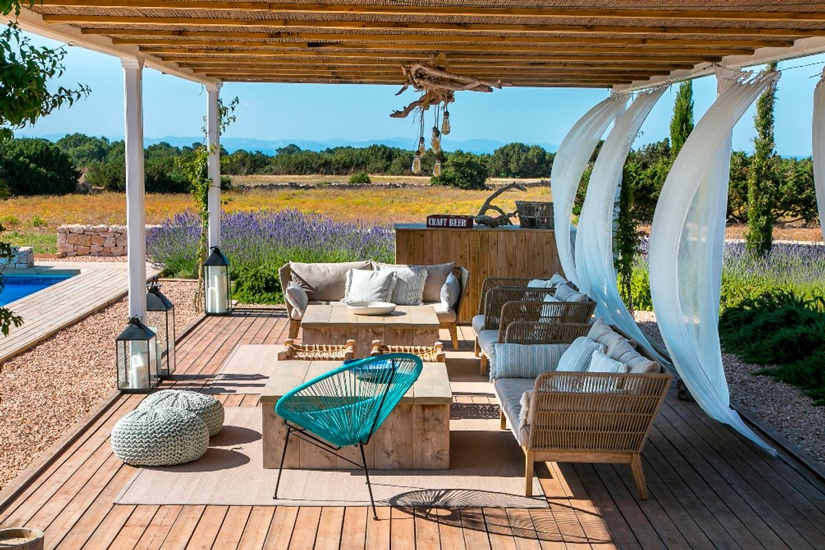 Enjoy the shade and countryside views from the outdoor lounge