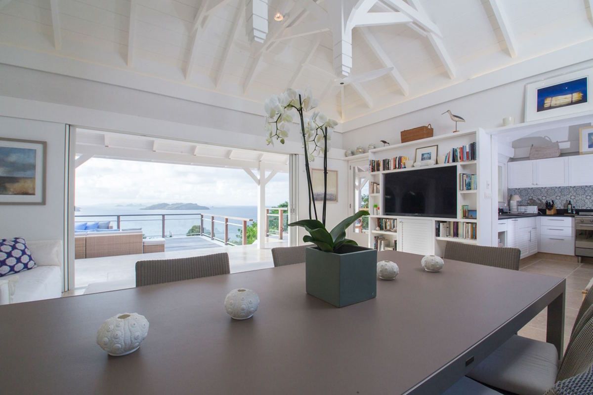 Larger dining table seats six in the open living/dining area
