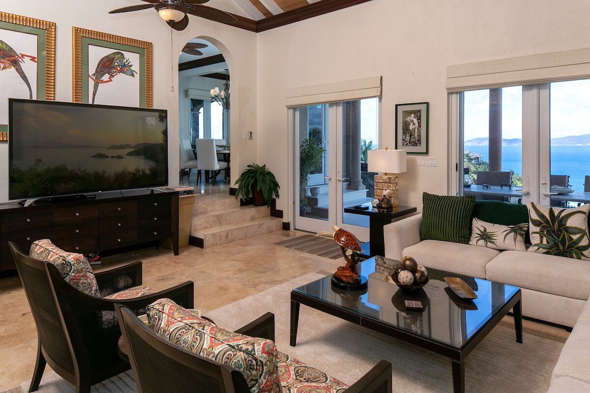 Bright and spacious living room with comfortable seating, stylish furnishings, and plenty of natural light.