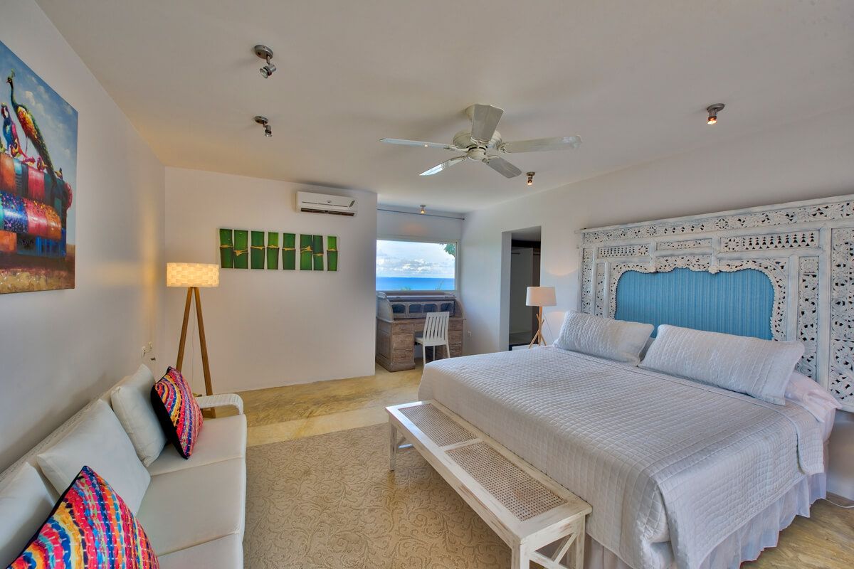 Cottage master bedroom suite with a king bed