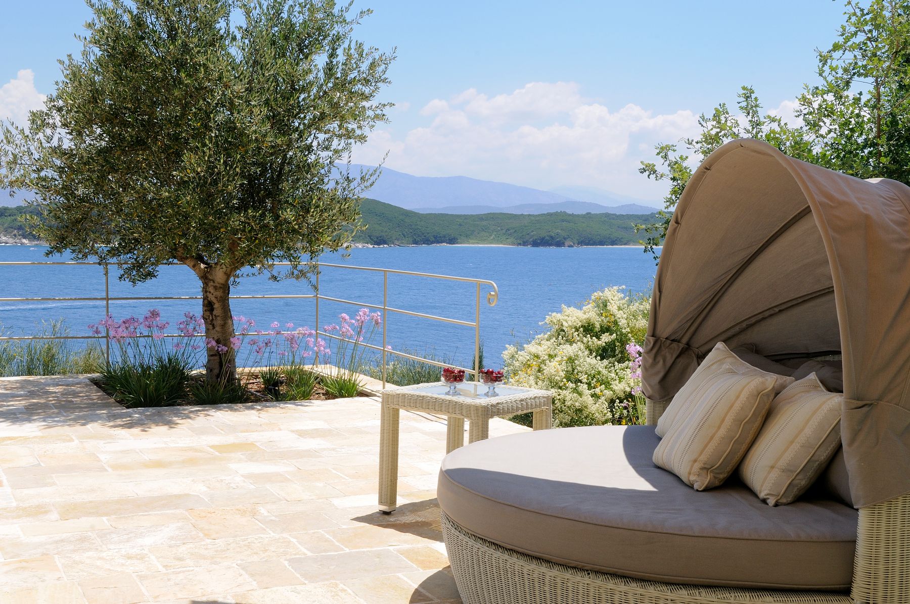 Savor those scenic sea views from the shaded daybed. 