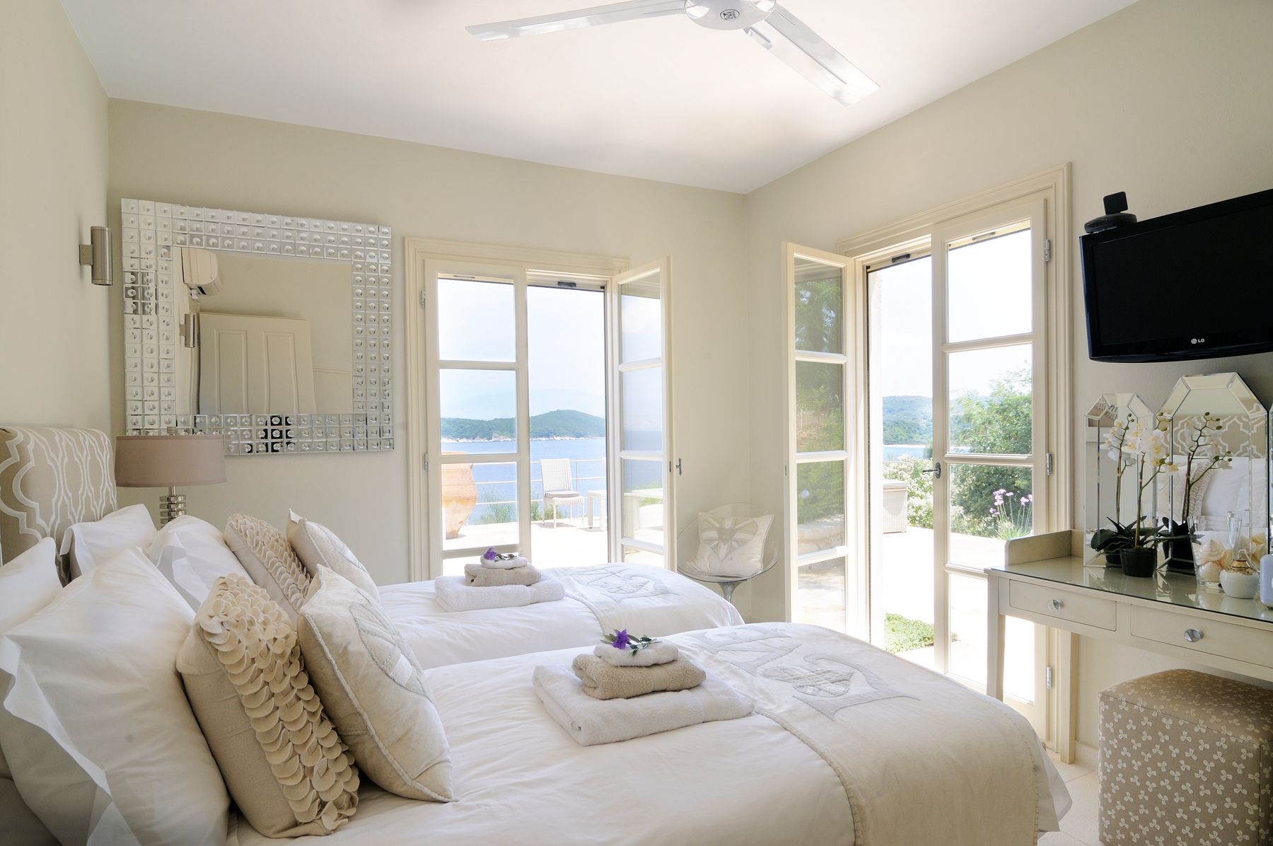 Bedroom with twin beds (can join into a king-size bed) with ensuite bathroom with shower, and access to a private terrace.