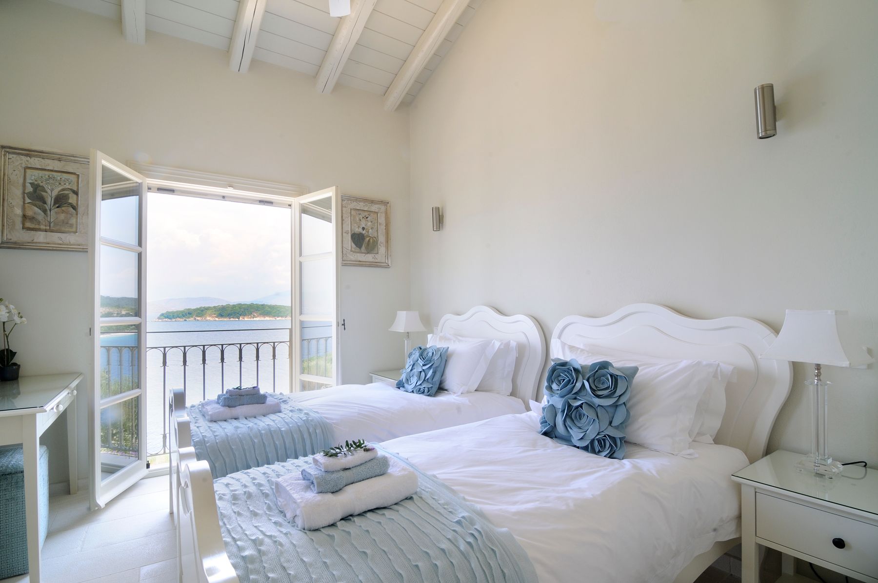 Bedroom with twin beds (can join into a king-size bed) with ensuite bathroom with a shower, and Juliet balcony.
