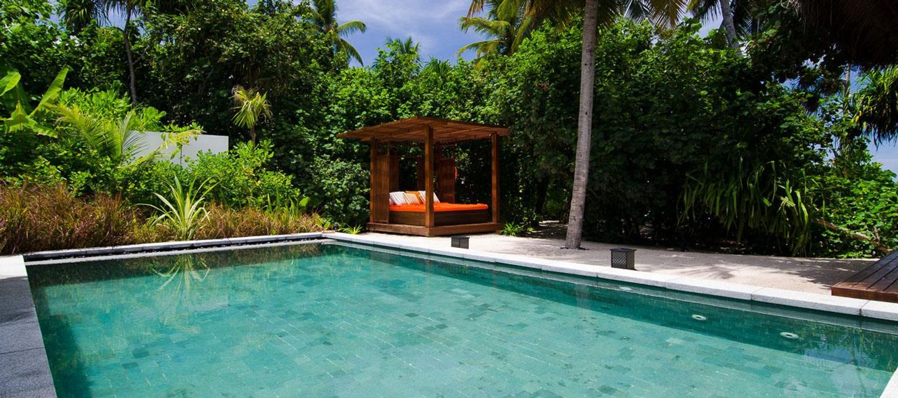 Jumeirah Dhevanafushi Beach Sanctuary Sunset villa photo.