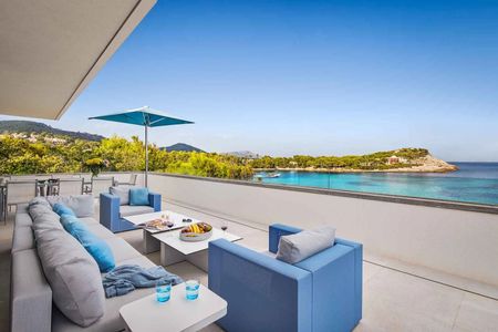 Panoramic sea views from the expansive terrace with dining and lounge areas.