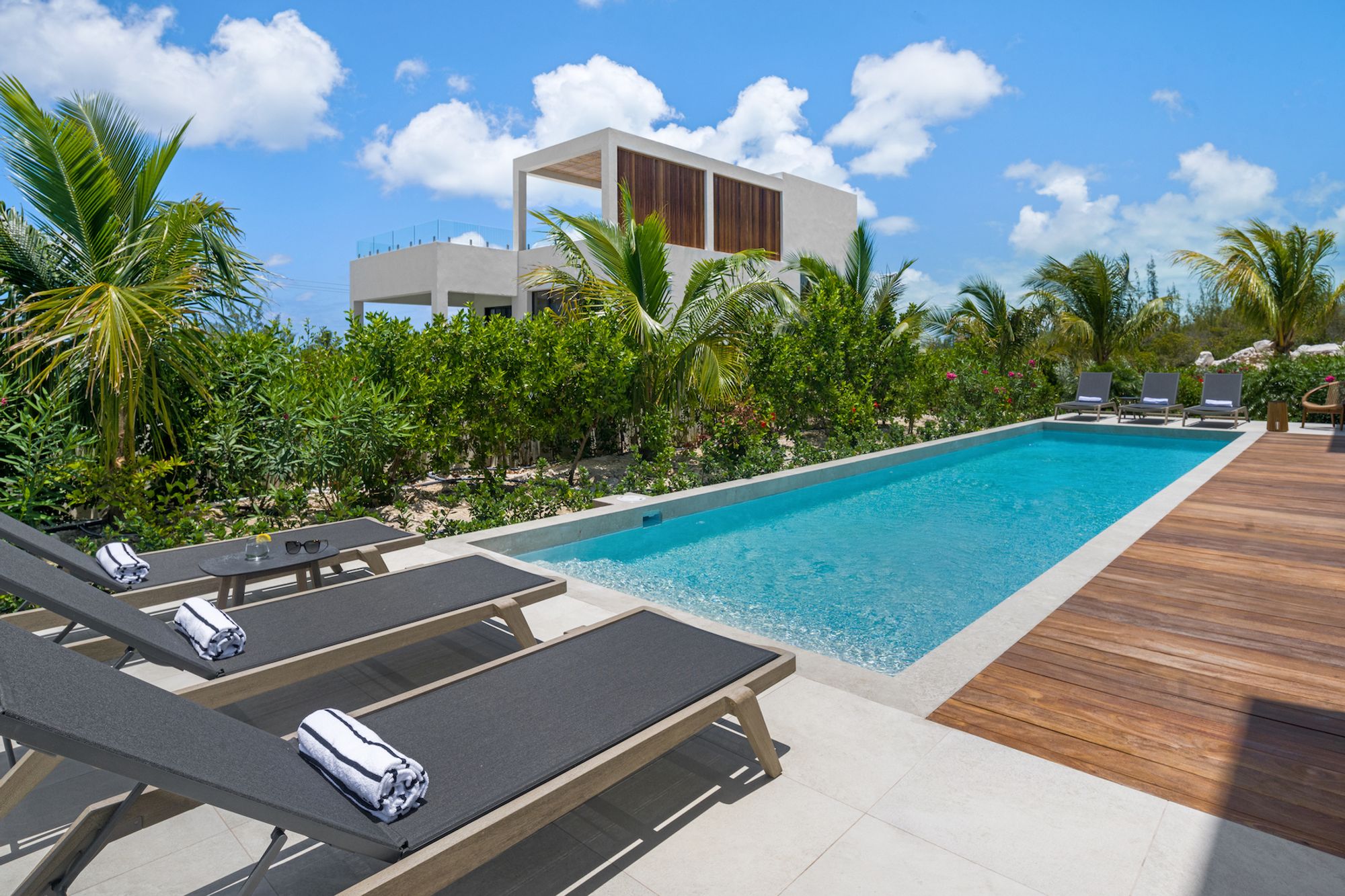 Swimming pool with loungers