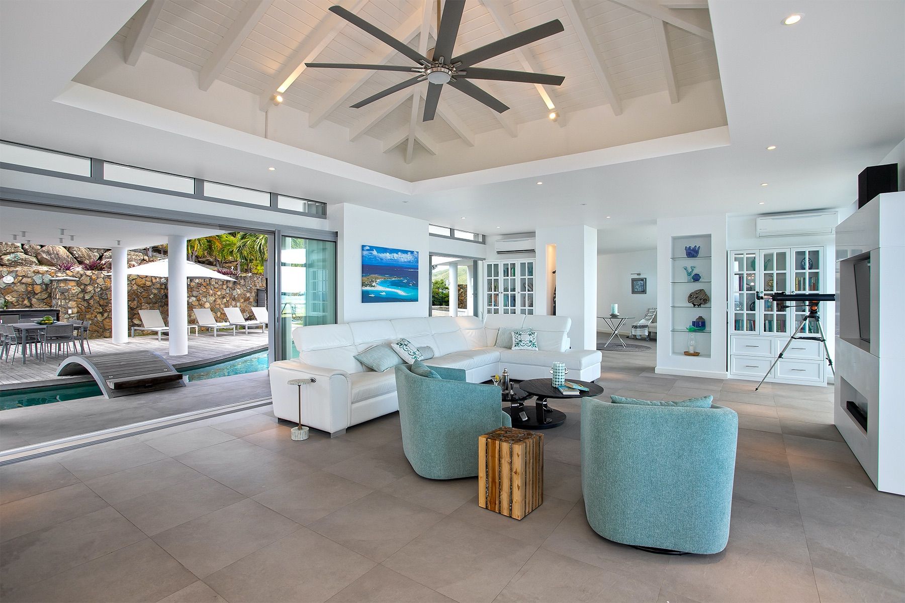 Open living room with pool and sea views