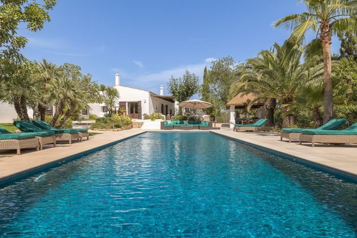 Large private pool which is surrounded by tropical palms