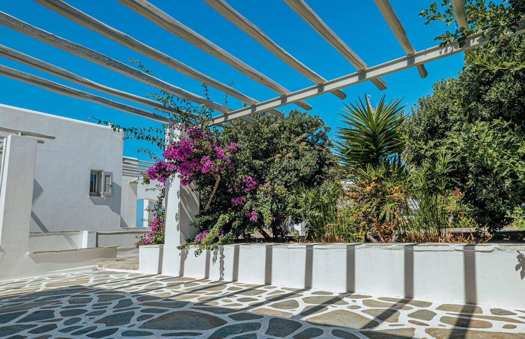 The villa is surrounded by verdant planting, gorgeous local flora and spacious terrace spaces.