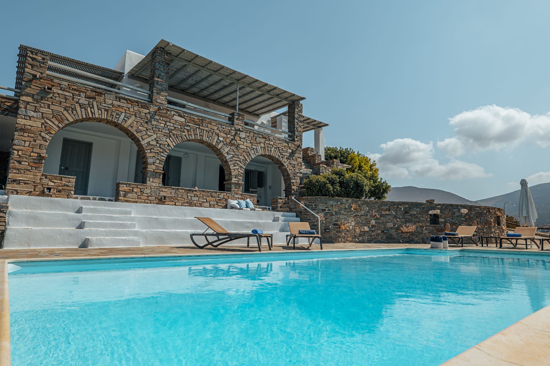 Spend time together in the expansive pool area, where you can choose a comfy sun bed to relax on. 