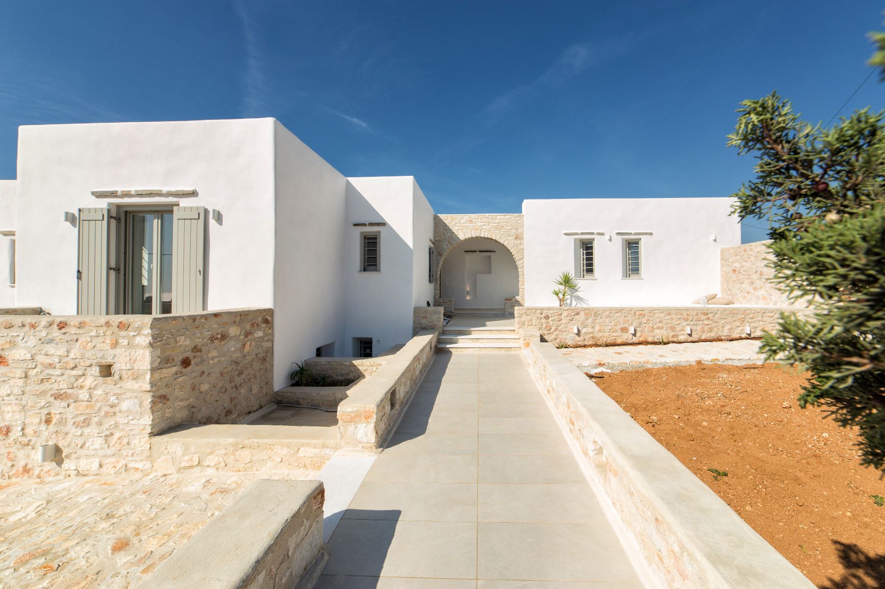 At this luxury villa, nature and architecture blend harmoniously, creating a serene environment for your luxury summer vacation. 