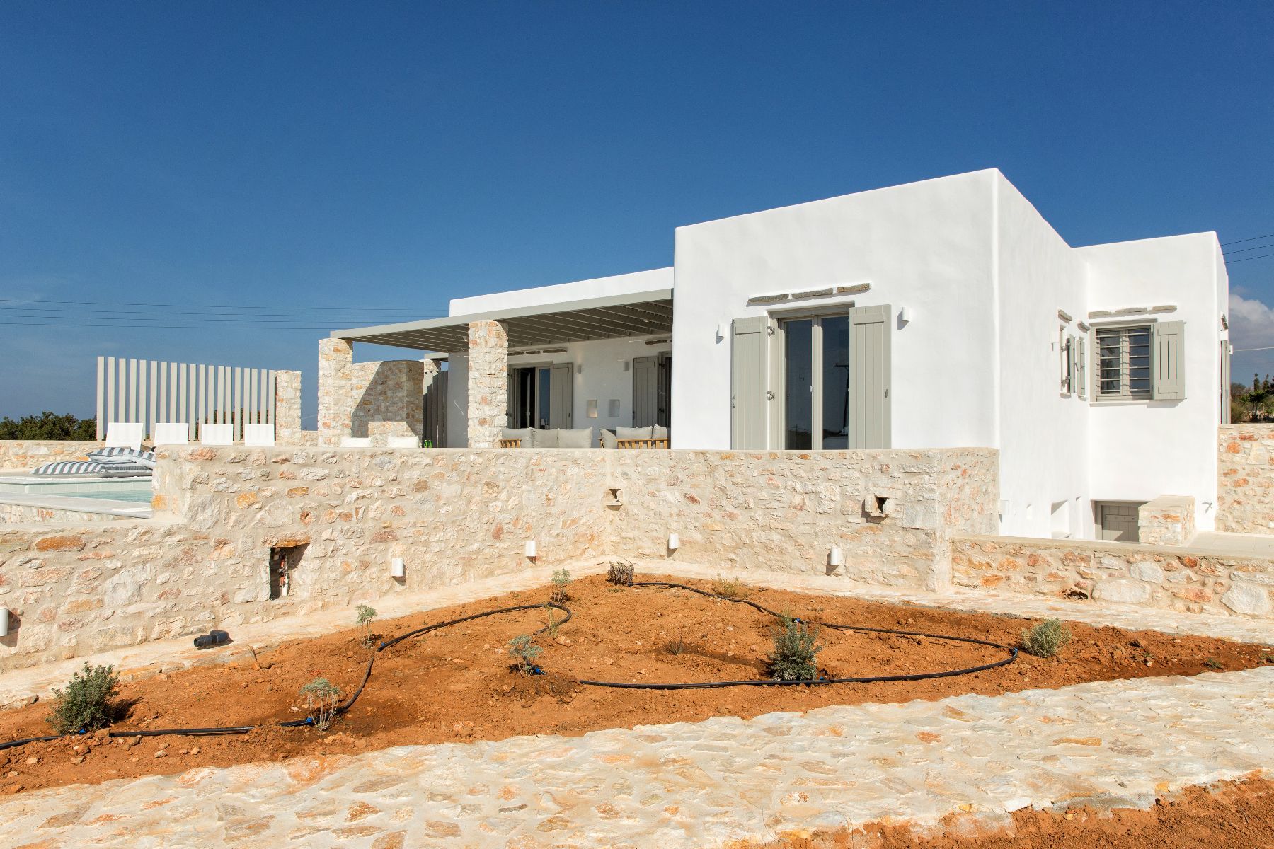 This 5-bedroom luxury villa has been designed to absolute perfection. Bright and modern yet filled with traditional Cycladic spirit.