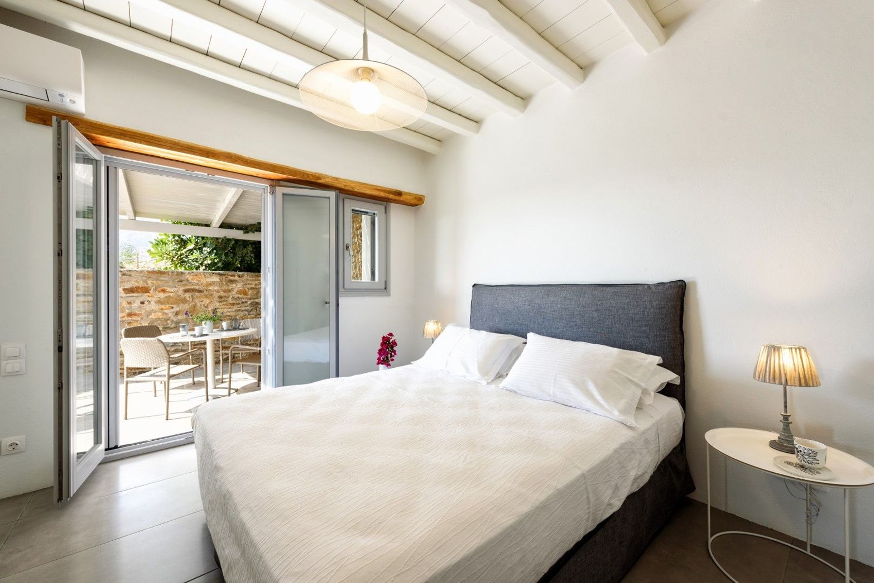 Double bedroom with access to a private patio.