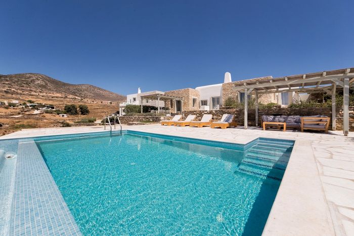 Luxurious villa built in the traditional Cycladic architectural style.