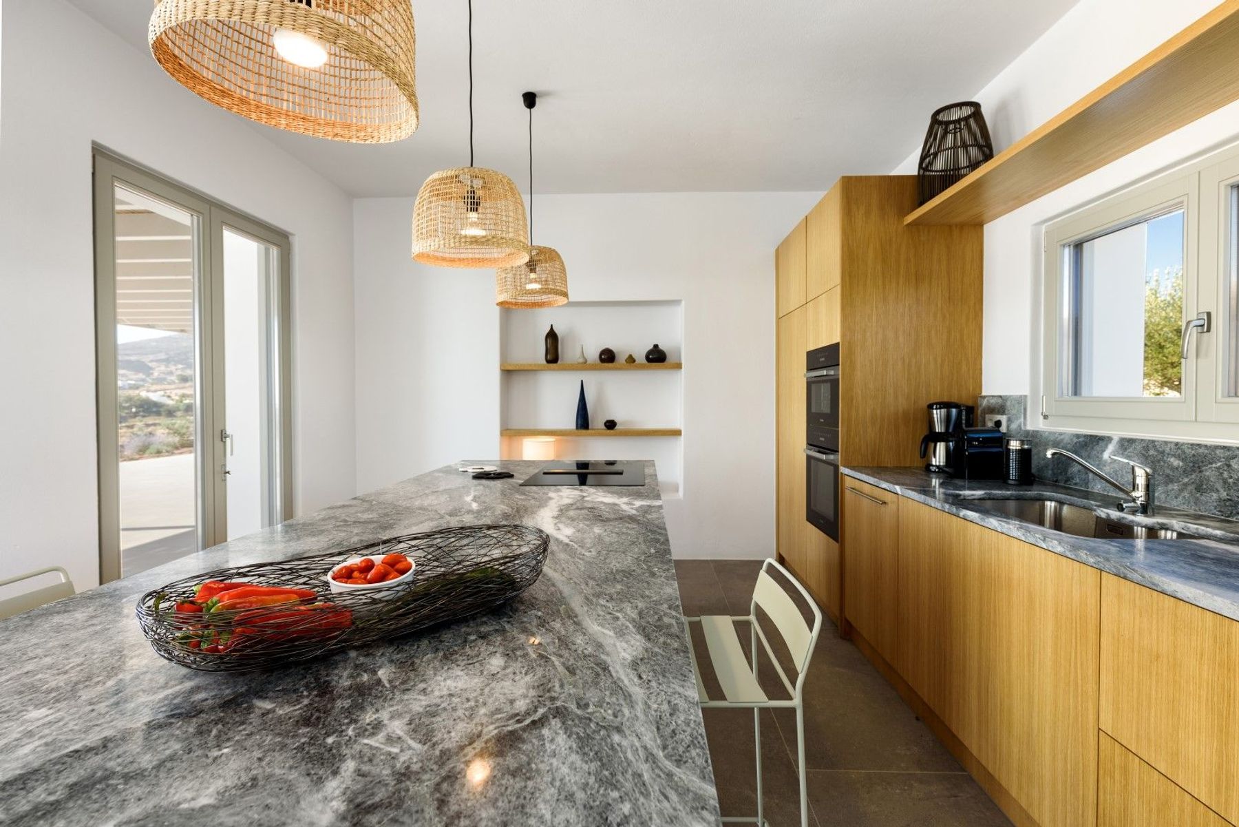 Spend time together around the large central island in the modern kitchen.