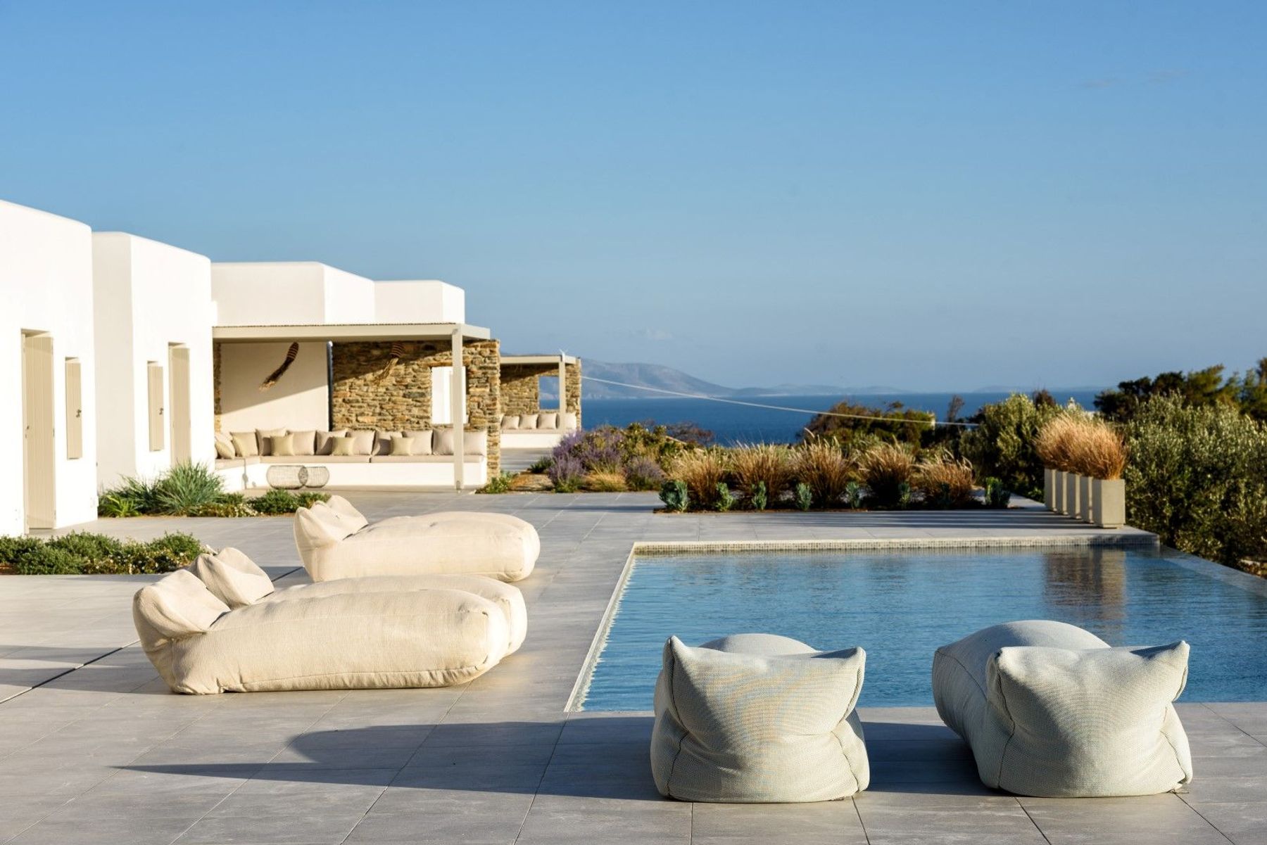 Private swimming pool with comfortable sun loungers for relaxing in the sunshine.