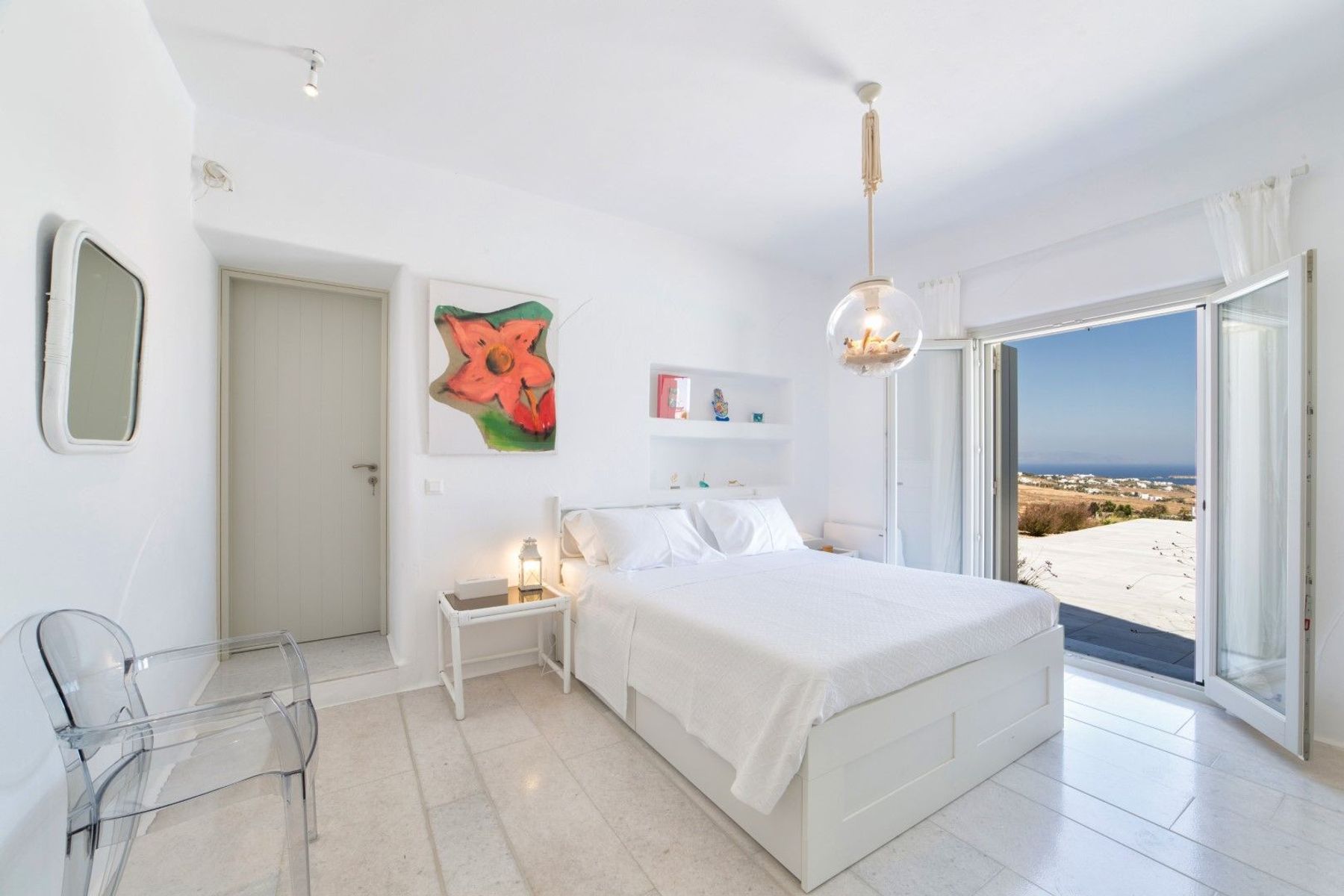 Double bedroom with direct access to the swimming pool area.