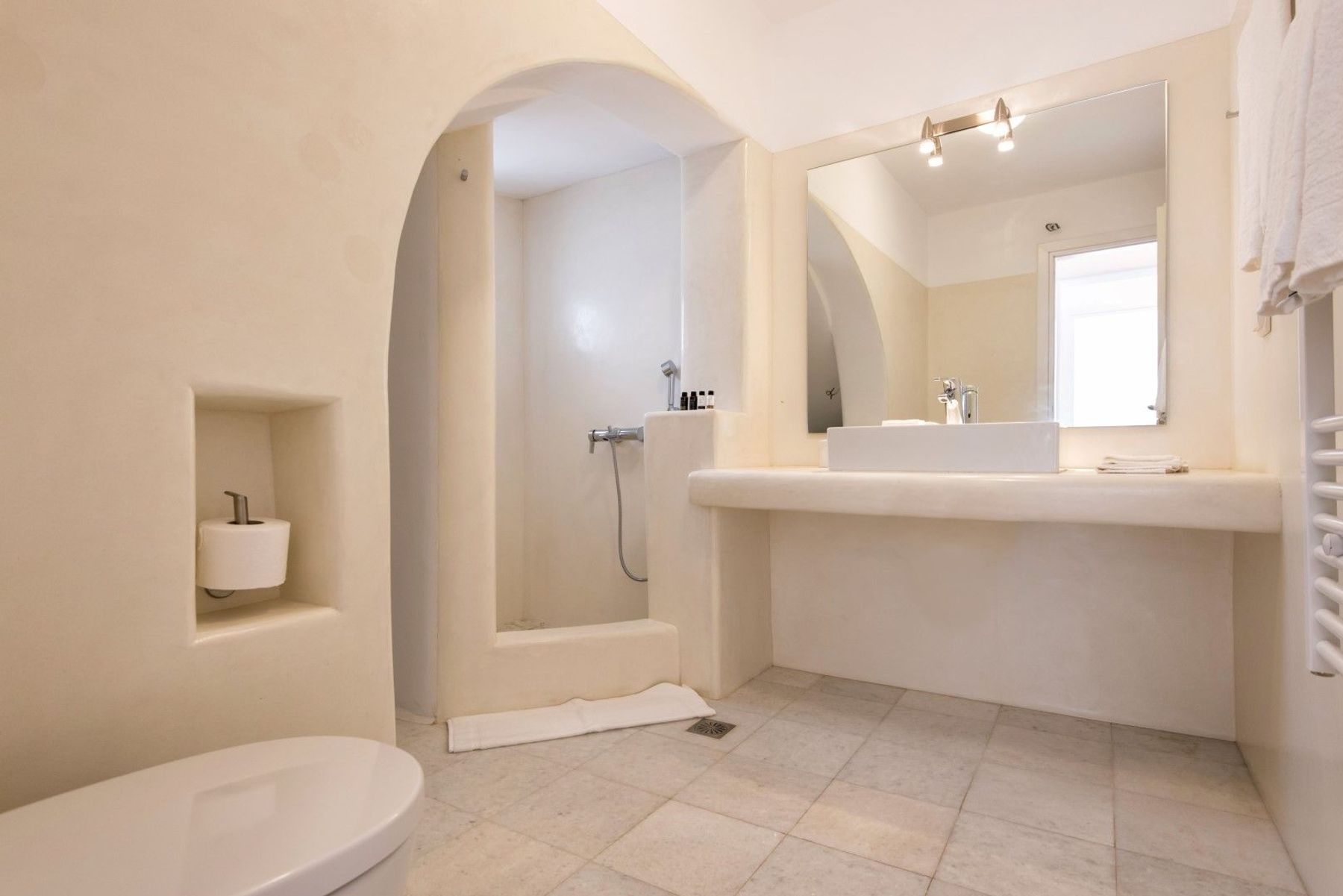 Bathroom with walk-in shower.