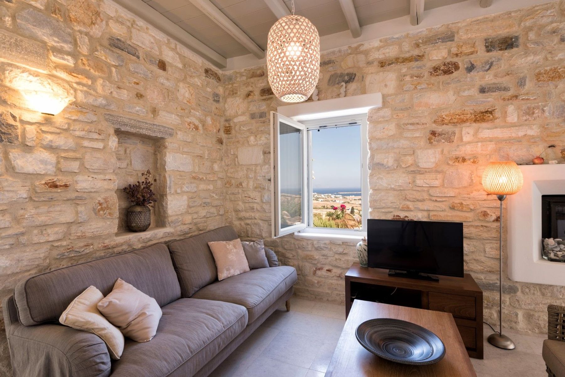 Charming living room area with television.
