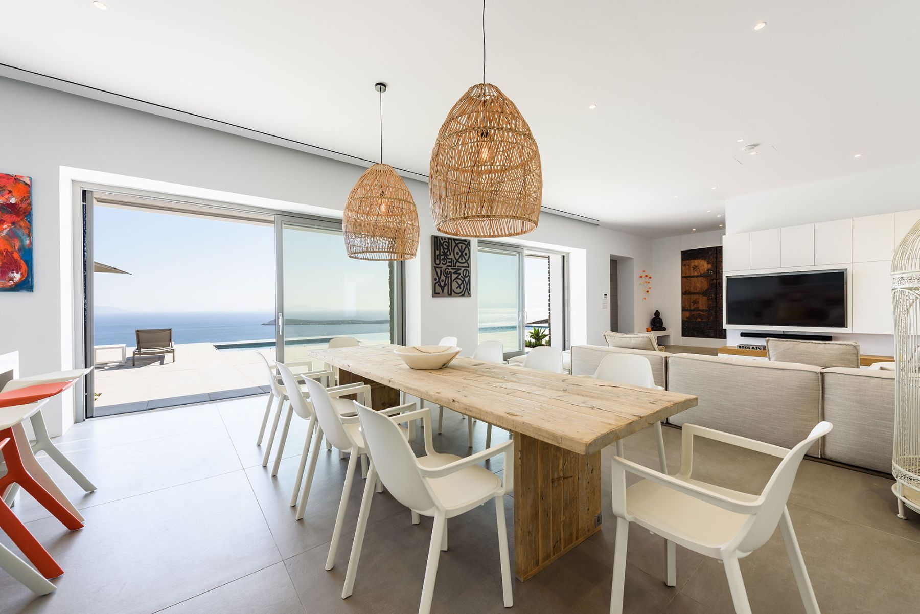 Large dining table seating up to ten people, with mesmerising sea views. 