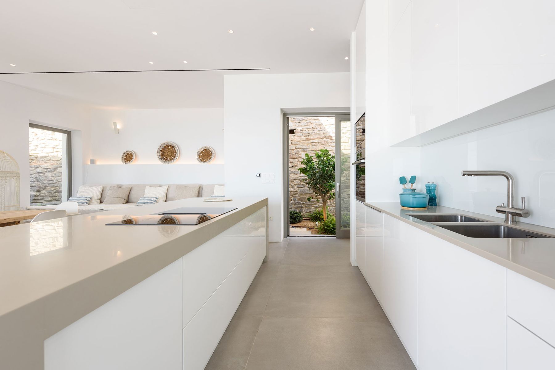 Modern fully-equipped kitchen with large central island.