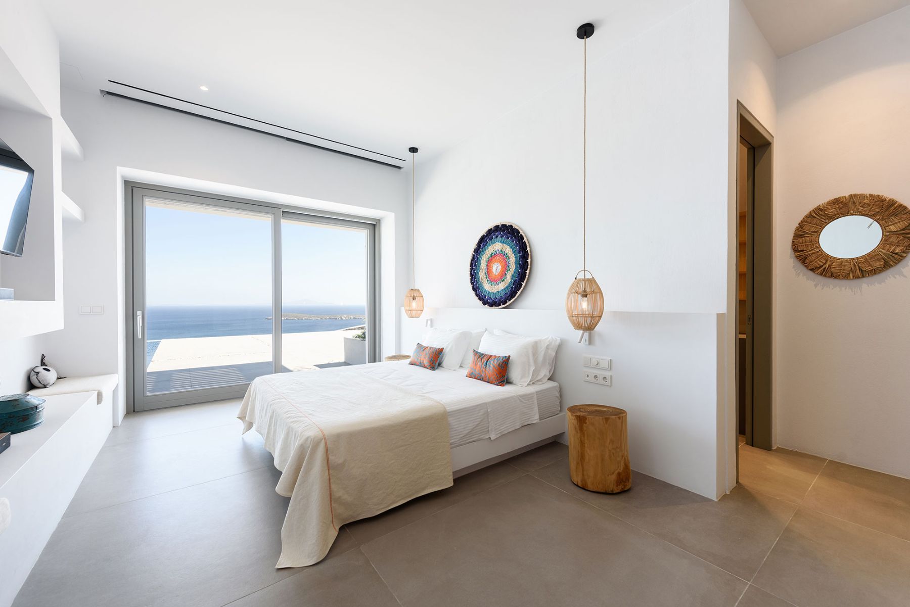 Spacious and bright double ensuite bedroom, with direct access to terrace, and sea views.