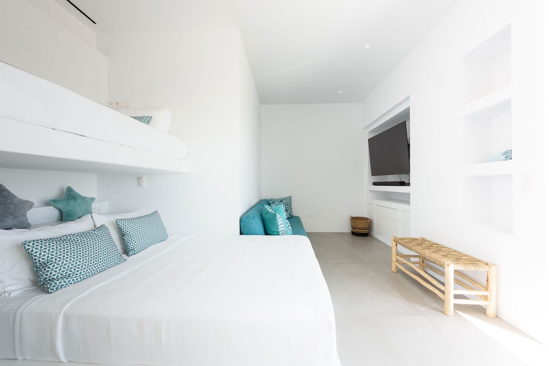 Ensuite bunk-room which can accommodate up for four guests, with television.
