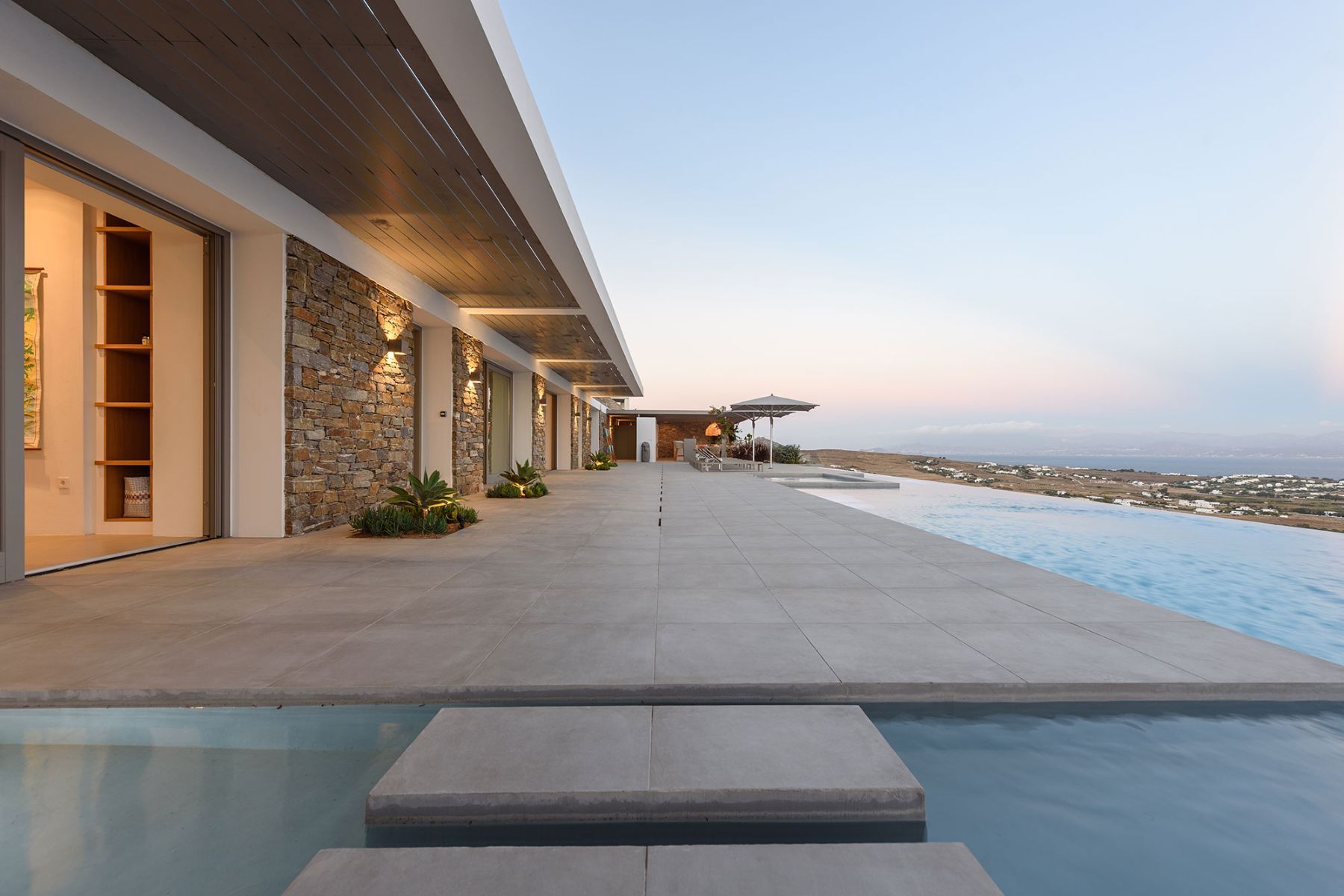 Enjoy sunset views from the spacious terrace and comfortable outdoor spaces.