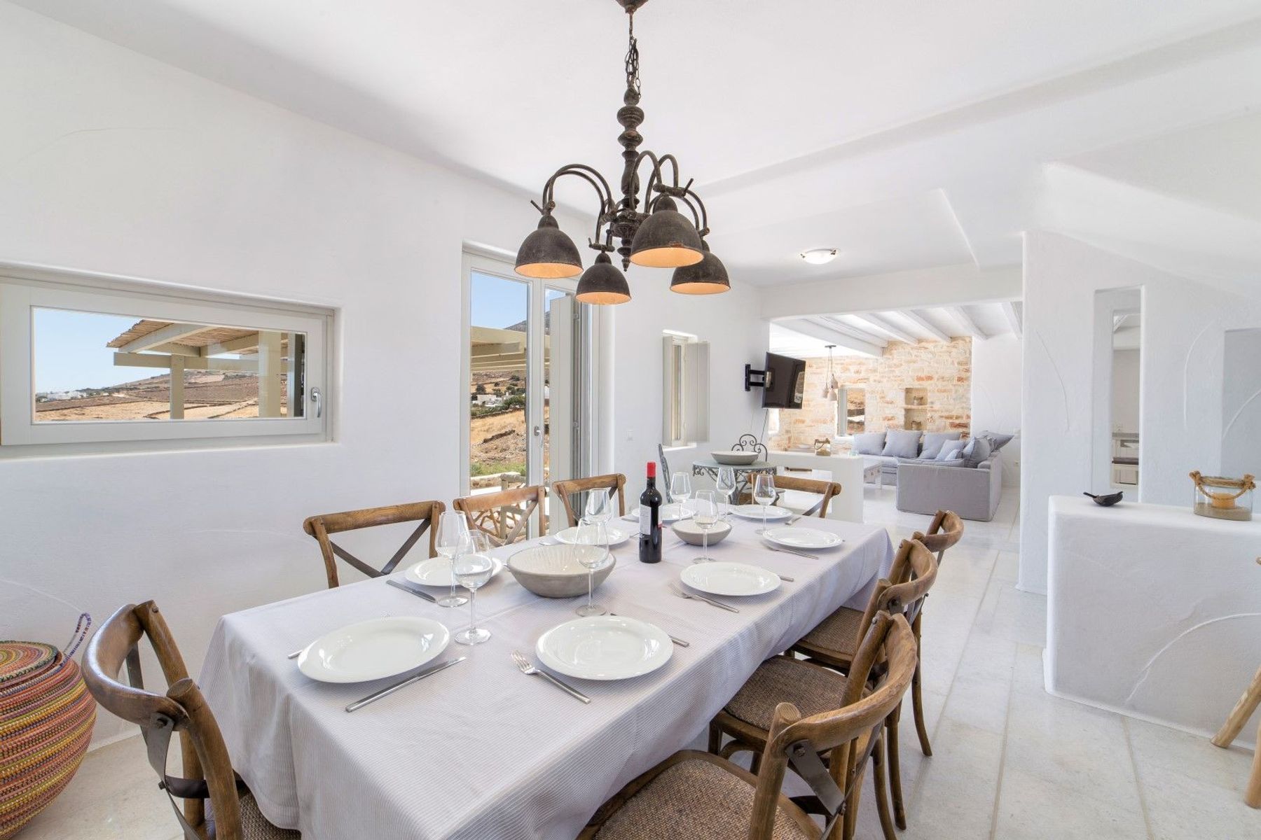 The charming dining area features a table for eight people. 