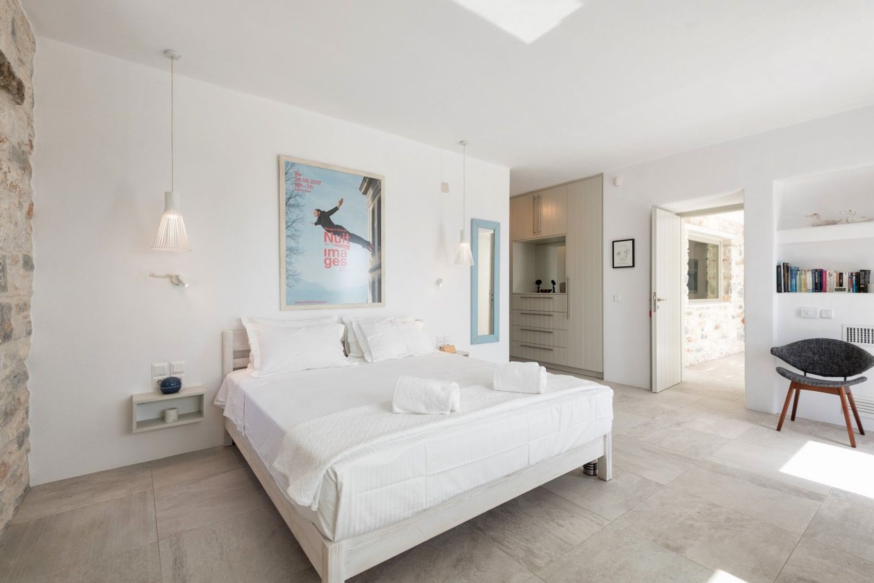 Double ensuite bedroom with built-in wardrobes and direct access to the pool terrace.