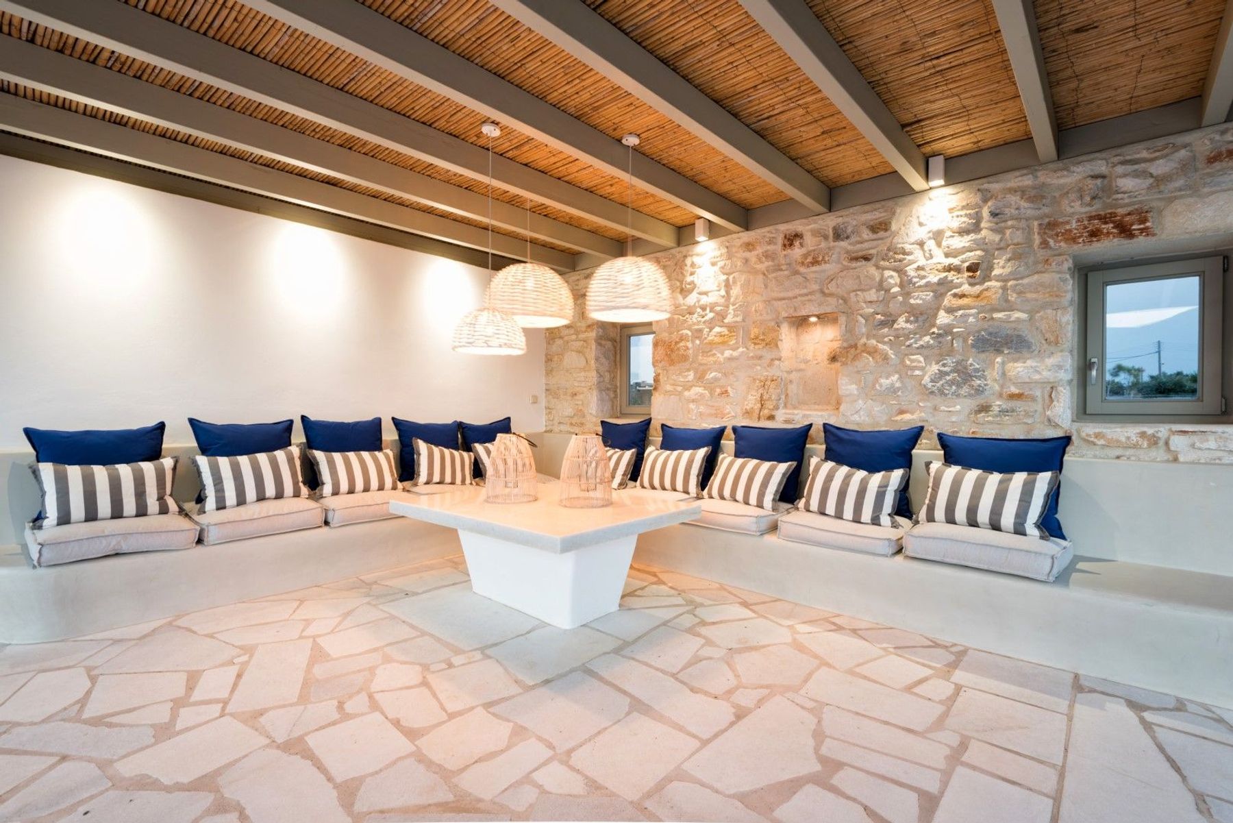 Spacious pergola-covered outdoor lounge with sweeping vistas.