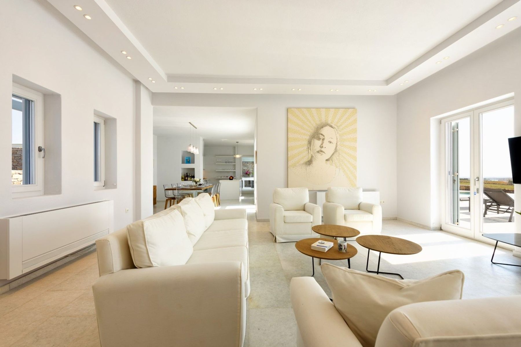 Contemporary open-plan living, furnished in cool colors giving the space a calming ambience.  