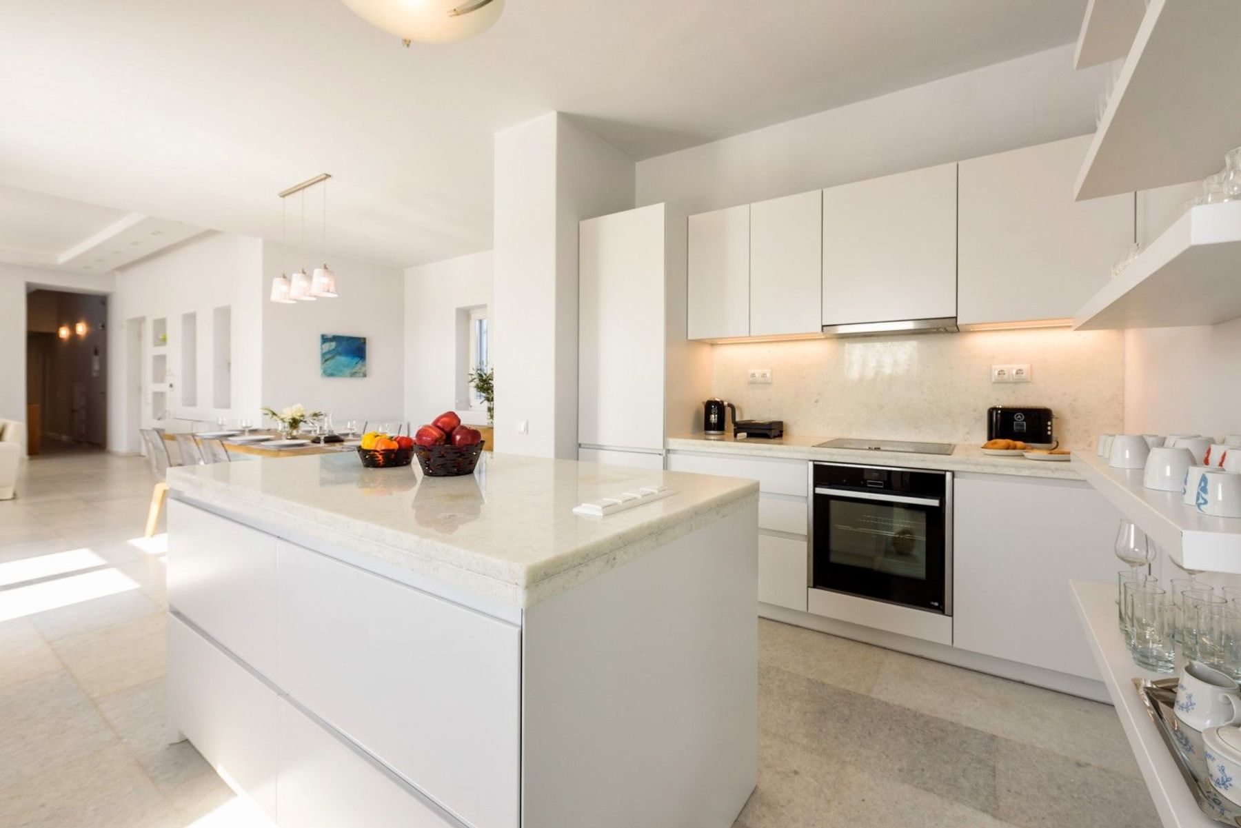 Fully-equipped modern kitchen with central island.