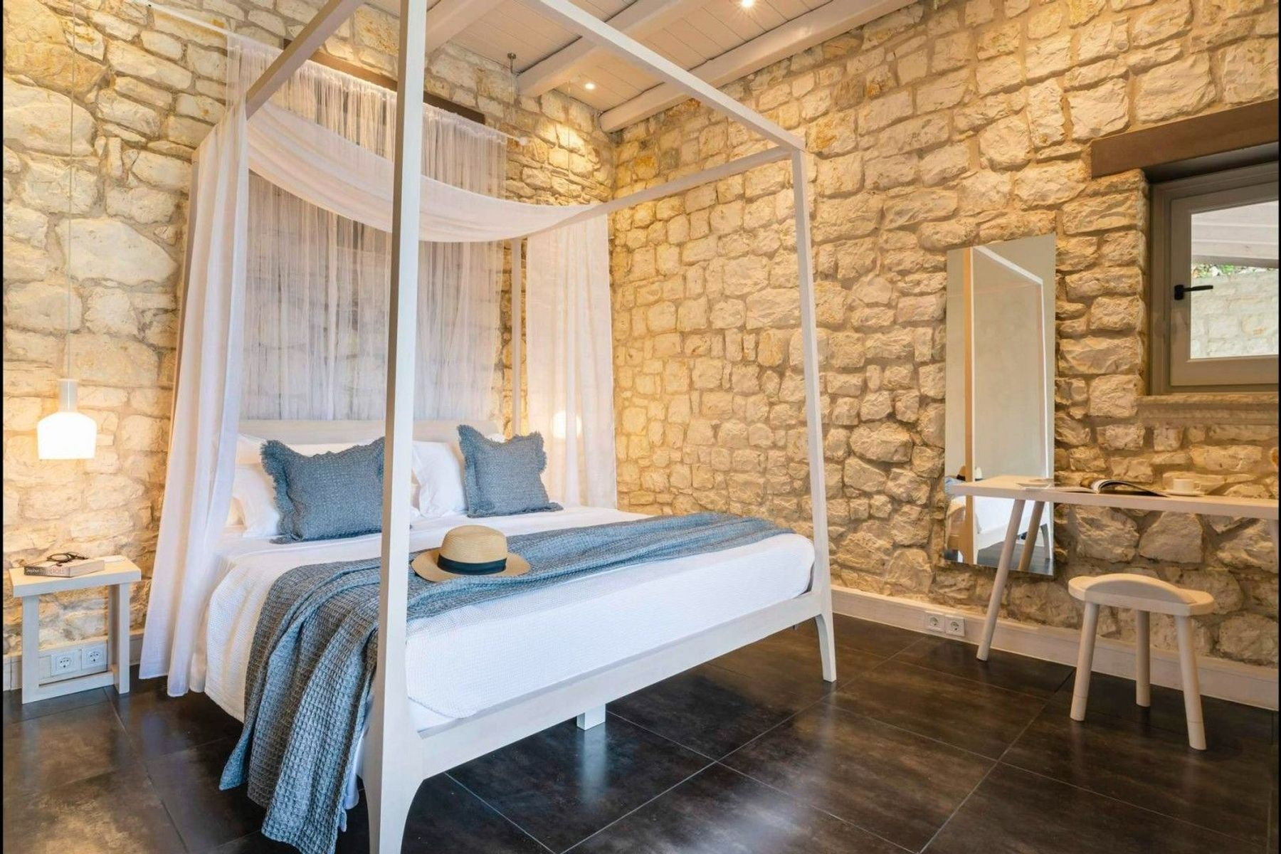 Double ensuite bedroom with access to the pool terrace, pool and a garden view.