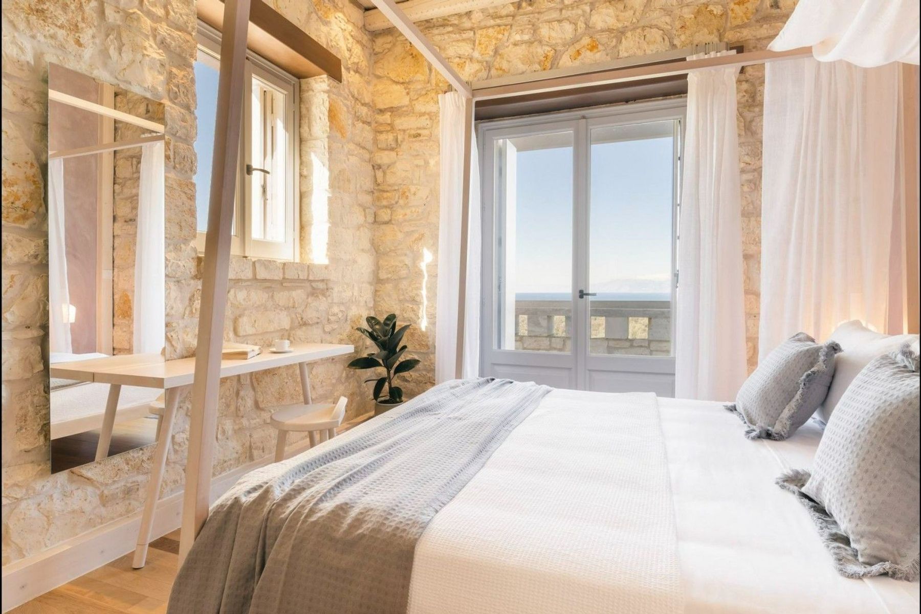Double ensuite bedroom, with a private balcony with lounge, and sweeping sea views.