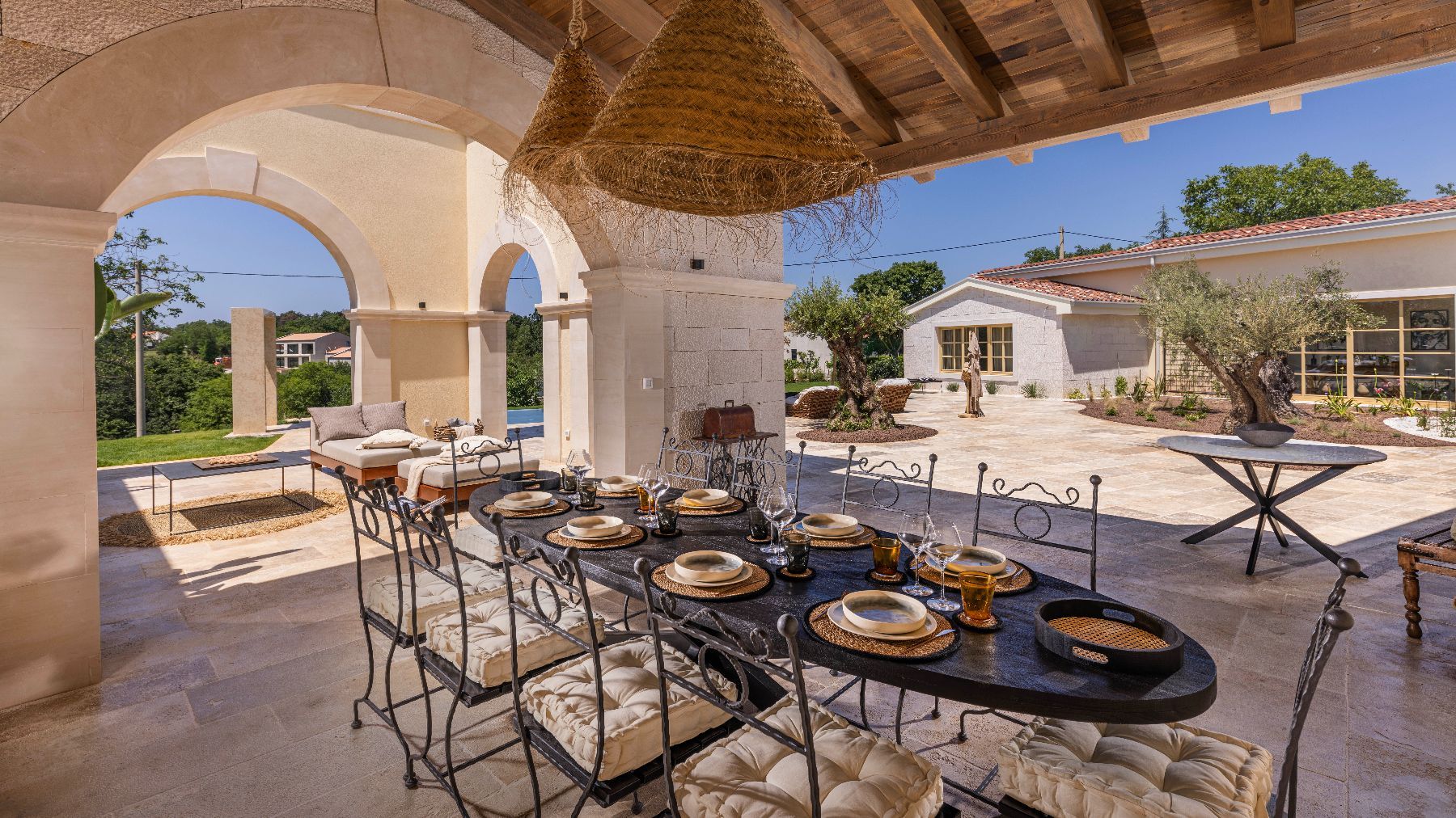Alfresco dining on the spacious outdoor terrace, with seating for ten guests.