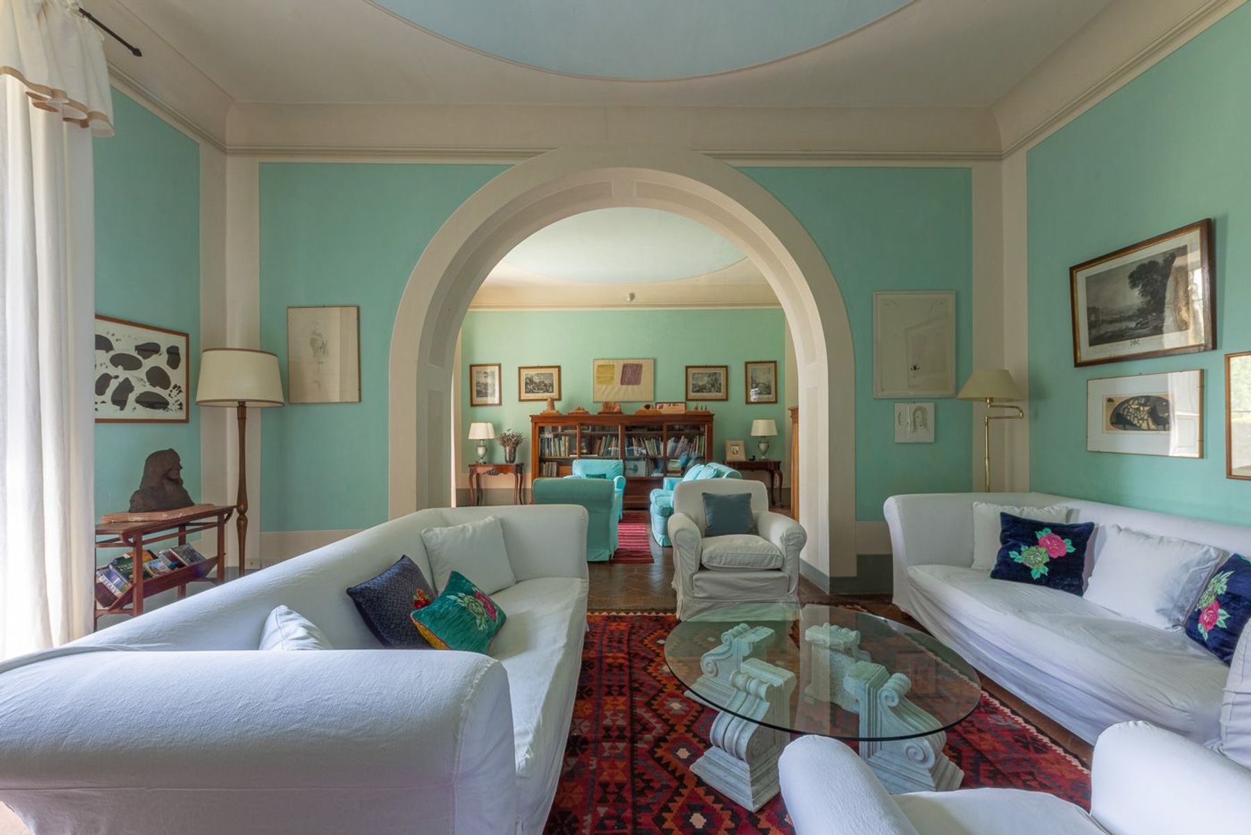 Spectacular open-plan lounge area adorned in the traditional style of an authentic Tuscan mansion.