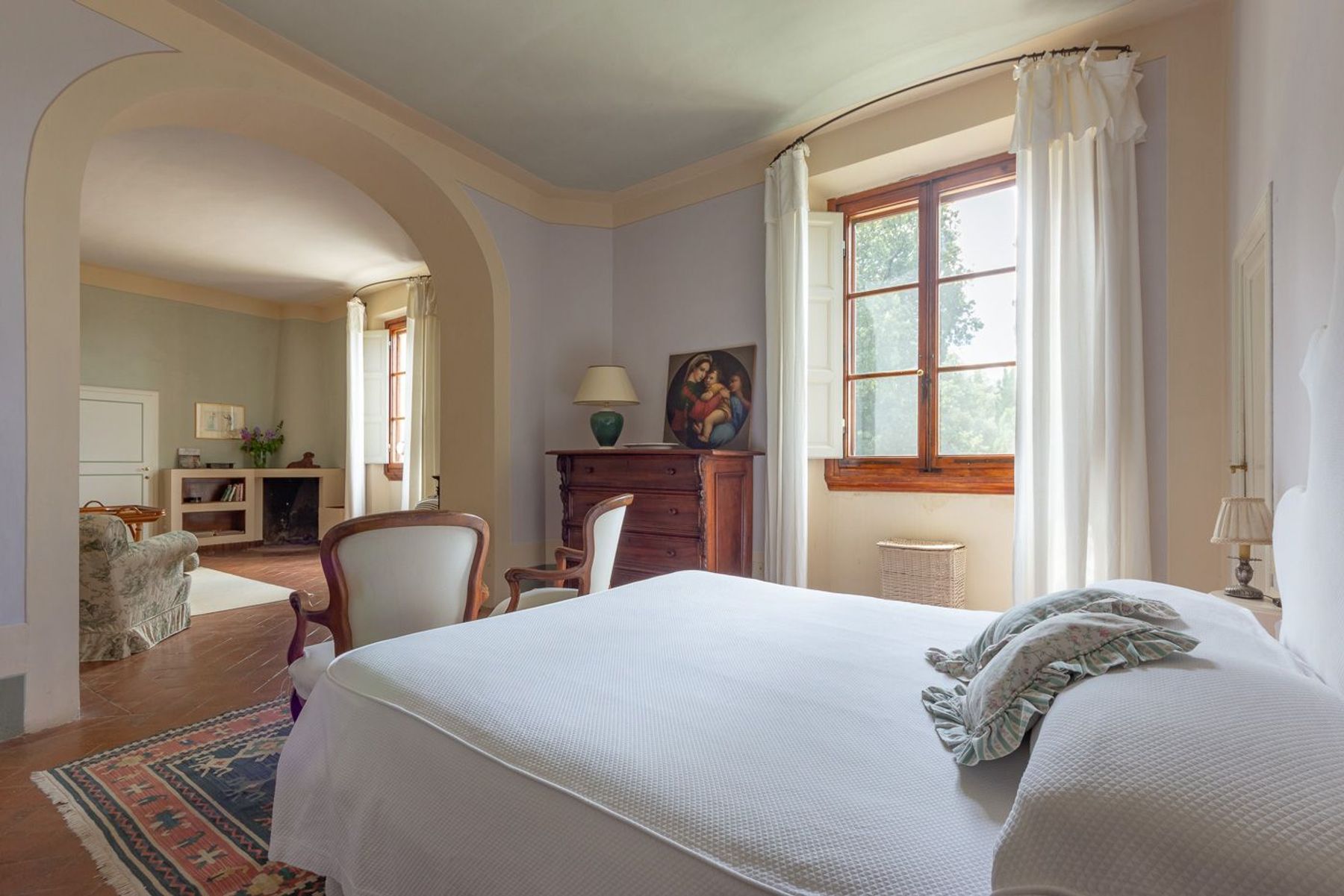 King ensuite bedroom with shower, air-conditioning and separate lounge area.