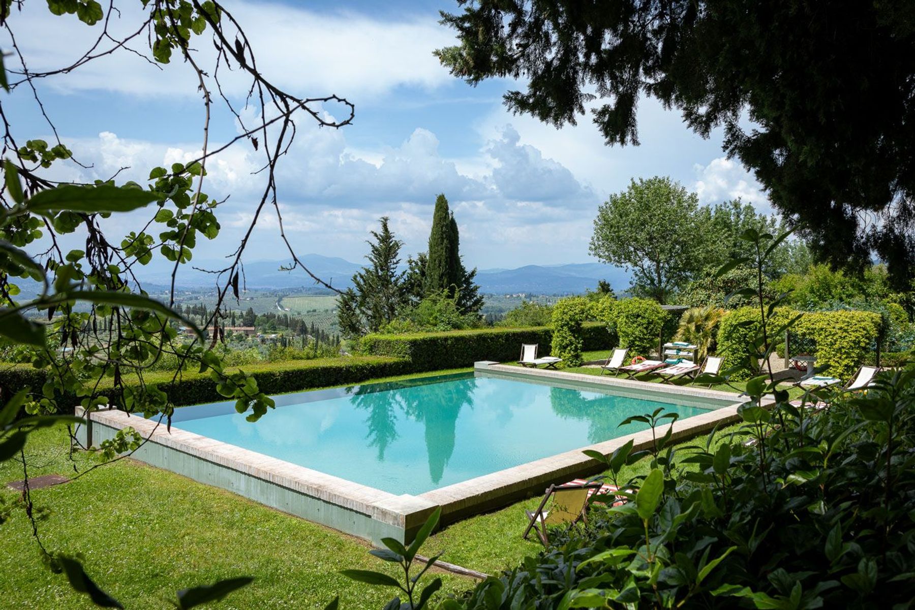 Sit back, relax and enjoy the breathtaking views, overlooking the idyllic scenery of olive groves and serene vineyards, creating a soothing backdrop.