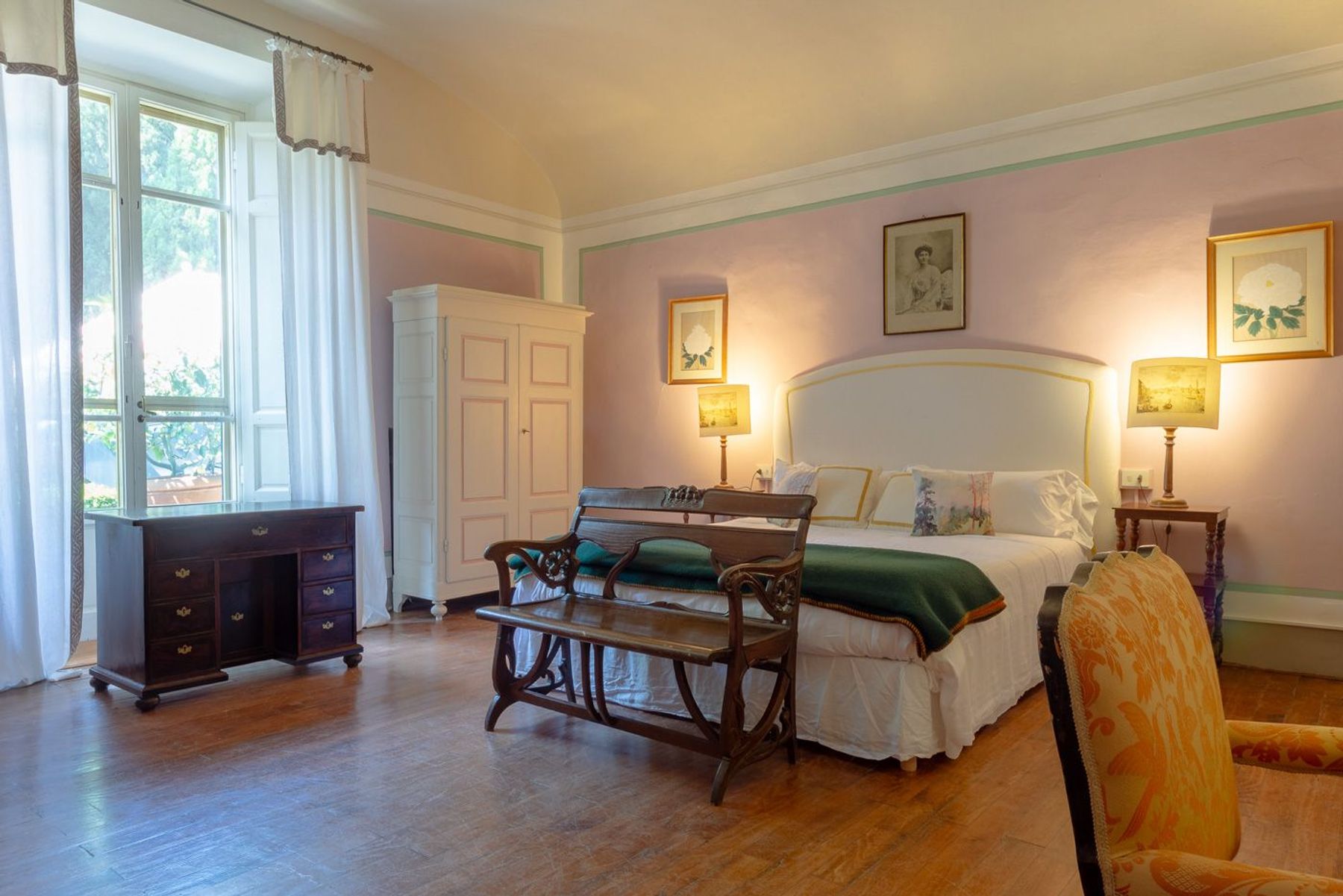 Spacious and bright double ensuite bedroom with charming antique furnishings.