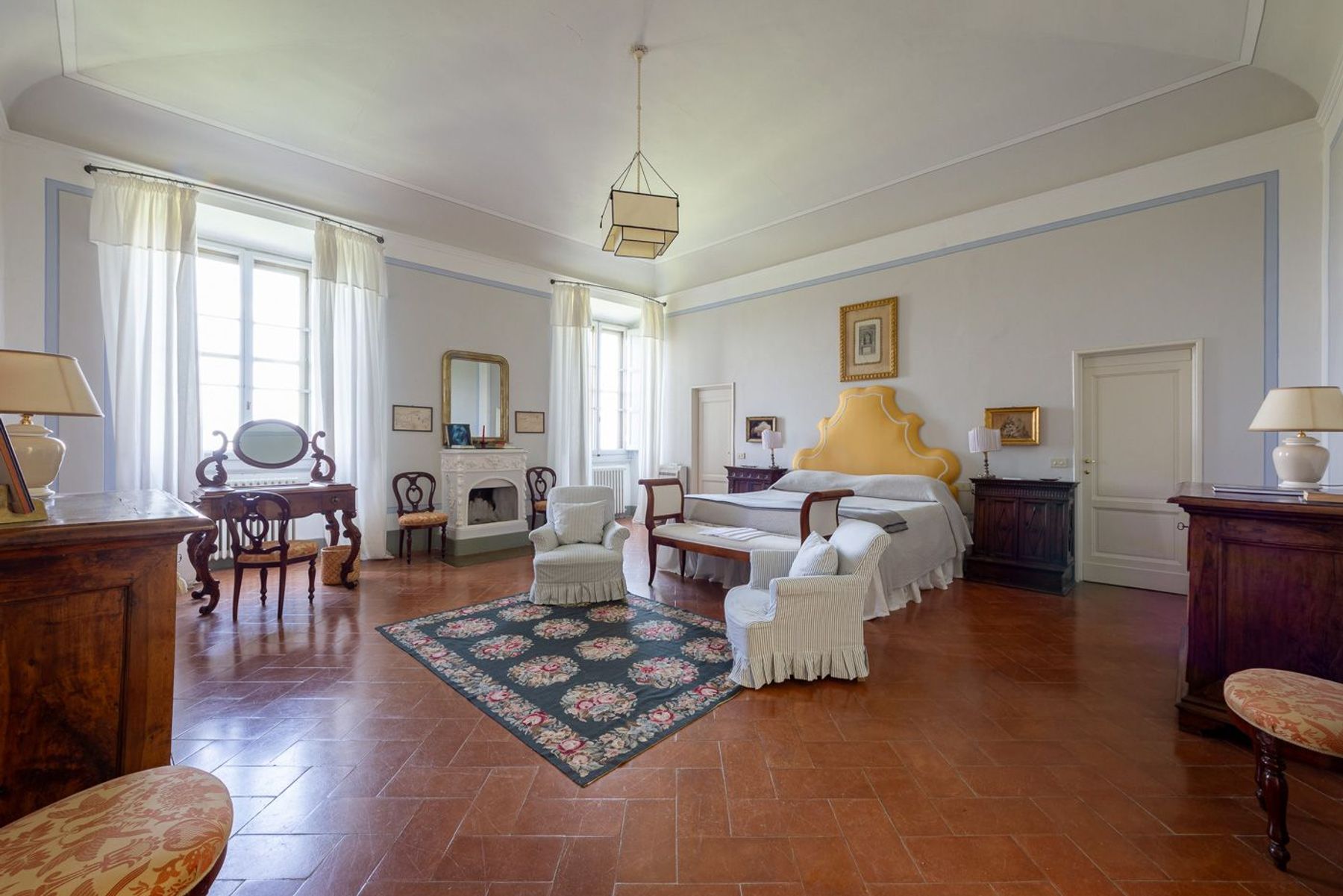 Spacious grand double ensuite bedroom, with charming fireplace.