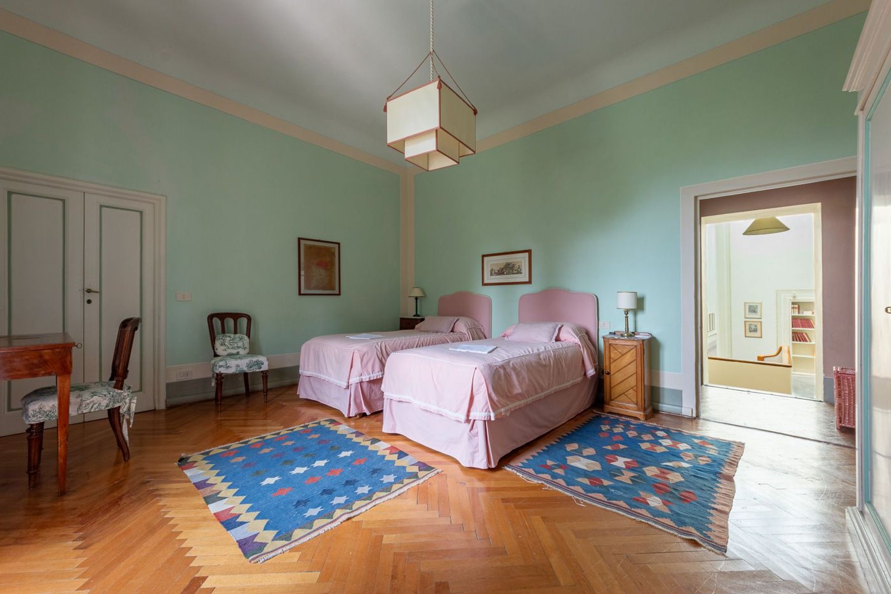 Twin bedroom with air-conditioning and plenty of space for guests to relax.
