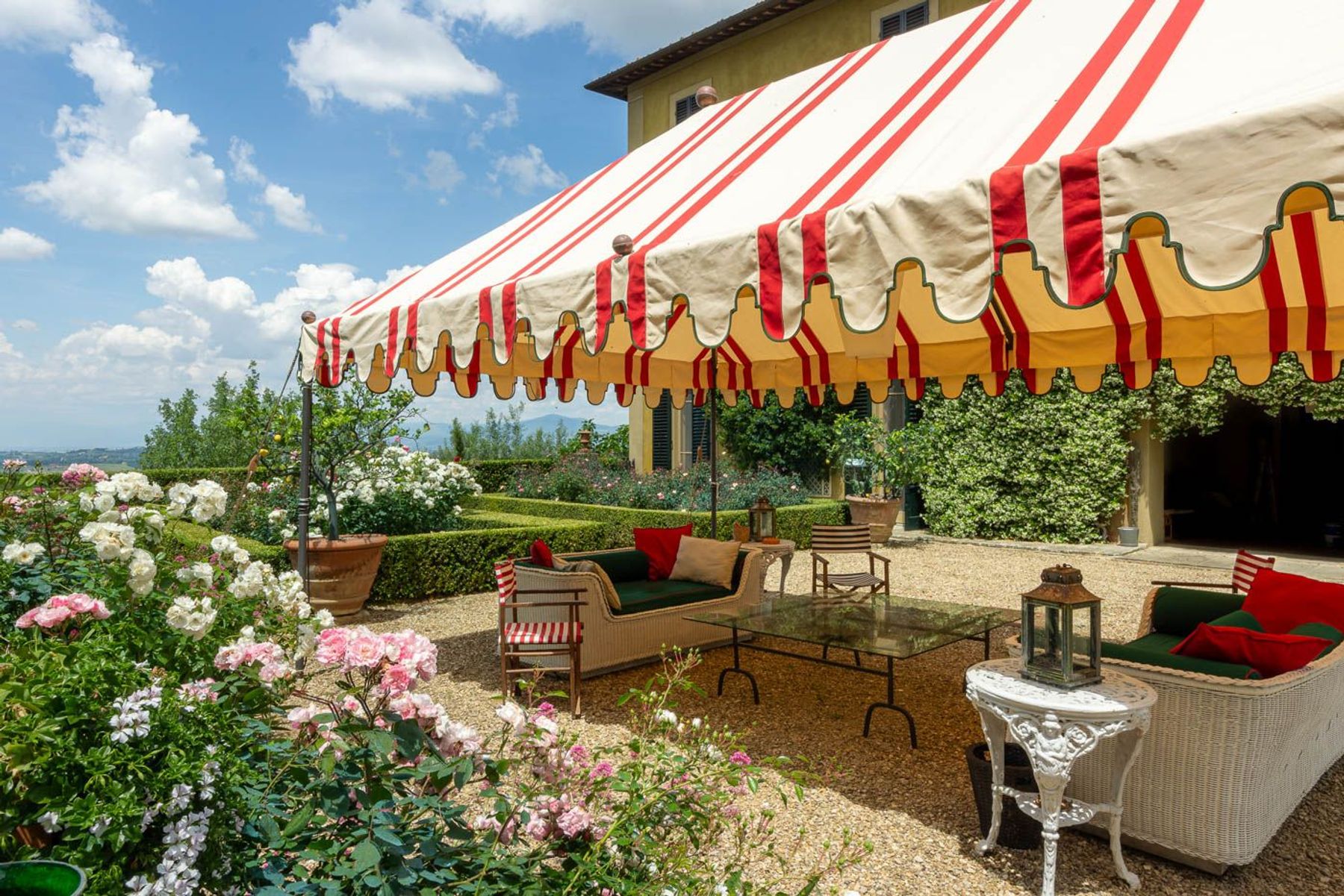 The panoramic terrace with an elegant gazebo offers a breathtaking view over the idyllic scenery of olive groves and serene vineyards.